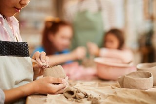 little-girl-shaping-clay-1024x683